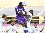 Fiorentina's Christian Kouame in action with Torino's Nicolas Nkoulou REUTERS/Alberto Lingria